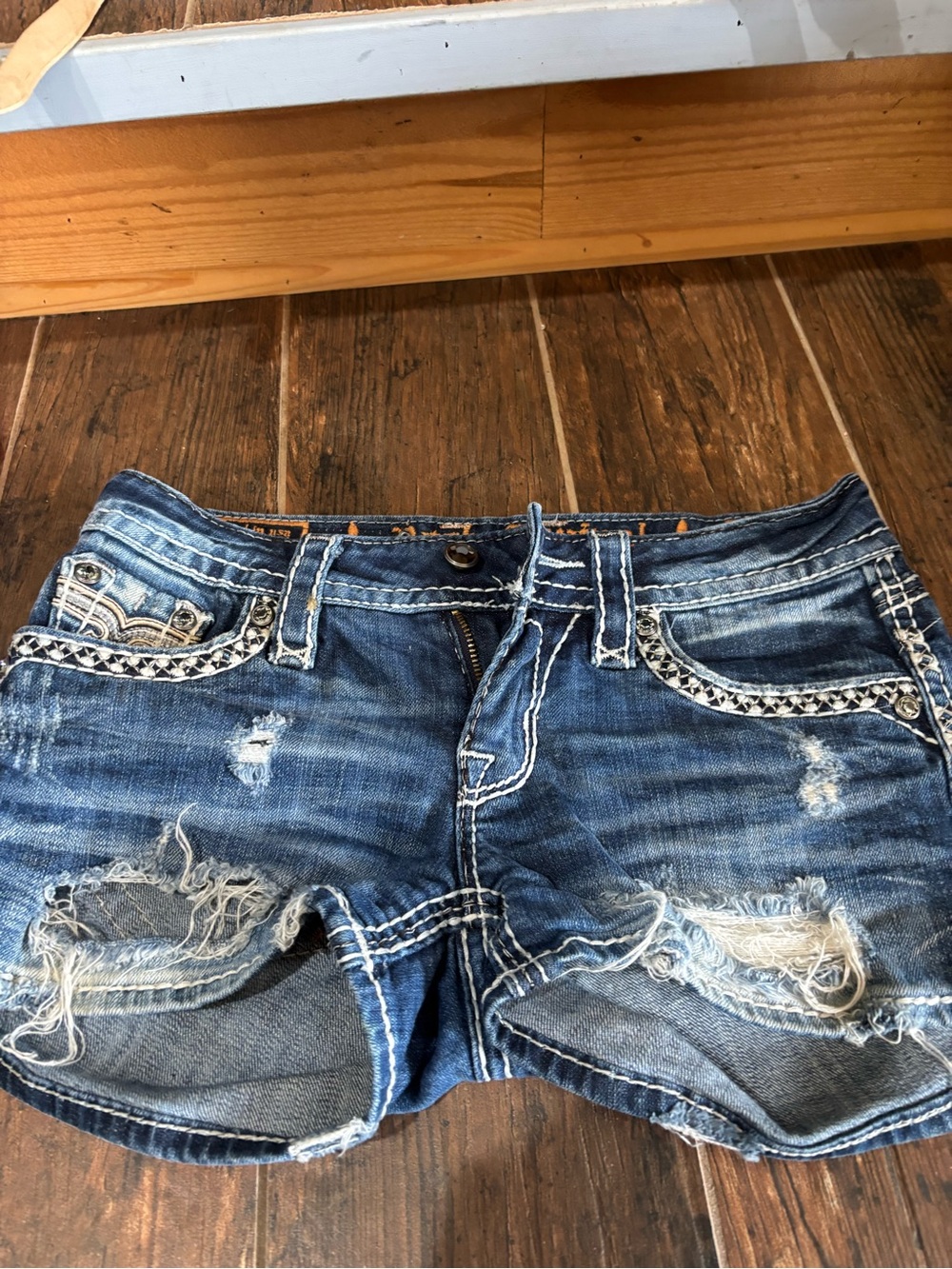 Women’s Distressed Denim Jean Shorts in Blue with Embroidered Trim